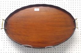 An Edwardian Mahogany Oval Tray, applied at either end with brass handles and with boxwood and