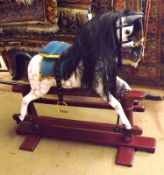 An early 20th Century Refurbished Child’s Rocking Horse, dapple grey horse with black replacement