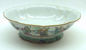 An Oriental Oval Dish, the outer body painted in famille rose and verte with various Oriental