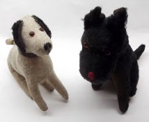 An early 20th Century Black Mohair Covered Sitting Scottie Dog; together with a further Mohair