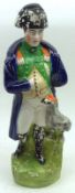 A 19th Century Staffordshire Figure of Lord Nelson with attendant bird, decorated throughout in