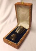 A 20th Century Boxed Set of a white metal Beaker with ribbed decoration and matching Napkin Ring,