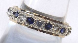 An unmarked yellow metal and Sapphire/white stone set Eternity Ring