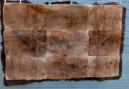 A large Kangaroo Skin Rug dated 1949, backed with brown wool felt bearing furrier label T.C.