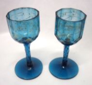A pair of 19th Century blue glass Drinking Glasses of shaped circular form, the bowls gilded with