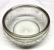 A large Squat Clear Cut Glass Bowl, decorated with star cut design, fitted with a silver collar,