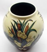 A Moorcroft wide tapering Vase, decorated with bulrushes and water lilies, Limia pattern, various