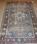 A Caucasian Rug, triple gull border, centre with three cruciform type lozenge panels, mainly dark