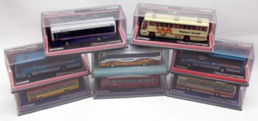 Eight Corgi Collectors Buses, each housed within a clear Perspex case