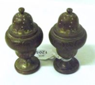 A pair of Squat Silver Plated on Copper Pepper Pots with chased floral detail, very worn
