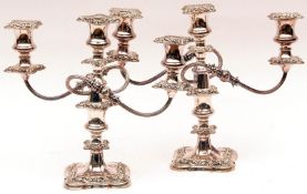A pair of Silver Plated on Copper three branch Candelabra fitted with removable nozzles decorated