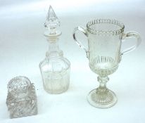 A 19th Century Clear Glass Octagonal Decanter with pointed stopper; together with a further