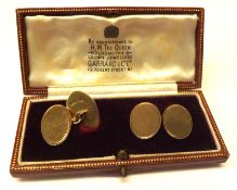A pair of 9ct Gold Cufflinks of typical oval form with engine-turned decoration, in a Garrard of