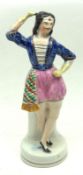 A 19th Century Staffordshire Figure of a dancing dandy, decorated in colours on a round plinth base,