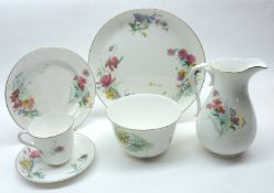 A Royal Worcester part Tea Service, decorated with meadow flowers on a white background,