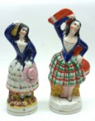 Two 19th Century Staffordshire Figures, modelled as female dancers, decorated throughout in