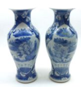 A pair of Oriental Baluster Vases, decorated in the Kangzsai manner, decorated in underglaze blue