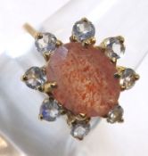 A hallmarked 9ct Gold Ring set with a Sunstone and Rainbow Moonstones
