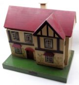 A mid-20th Century Dolls House made by Amersham Toys, single front opening to reveal to two rooms,