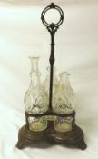 A 19th Century Silver Plate on Copper Three Bottle Stand of lobed design with central handle, raised