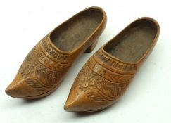 A pair of small Miniature Carved Clogs dated 1914 and 1919, 5” long