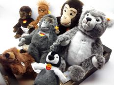 A box containing seven assorted Modern Steiff Animals to include: Baby Gorilla; Charly Pinguin;