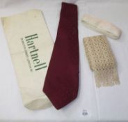 A 1970s Norman Hartnell Gents Tie in pure burgundy silk, still retained in original packaging;