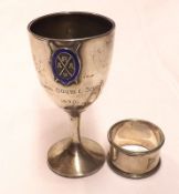 A small Pedestal Trophy Goblet on a spreading circular base, bears small enamel badge to front,