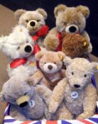 A box of seven assorted Steiff Teddy Bears of varying size and colour