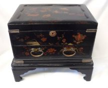 An early 20th Century Oriental Lacquered Table Casket of rectangular form, the lifting lid enclosing