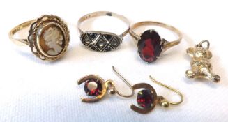 A hallmarked 9ct Gold Ring set with a Cameo; two further yellow metal Rings set with coloured stones