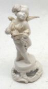 A small Continental White China Cherub Figure on pierced round base, 6” high