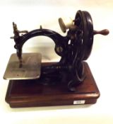 An early 20th Century Willox & Gibbs Automatic Silent Sewing Machine, in black cast iron with gilt