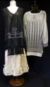 A 1920s Ladies Ensemble comprising of Ivory Satin Skirt with embroidered panel detail; white lawn