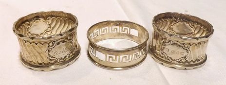 A pair of George V Napkin Rings, decorated with a ribbed design, cartouches marks L and AJM,