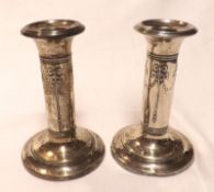 A pair of Edward VII small Dressing Table Candlesticks, the stems decorated with a raised design