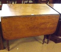 A 19th Century Mahogany Drop Leaf Dining Table of rectangular form, raised on six candy-twist legs