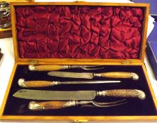 A Victorian Oak Cased Horn-Handled Carving Set, comprising two Knives, two Forks and a Sharpening