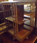 An early 20th Century Mahogany Revolving Bookcase of square form with crossbanded and boxwood and