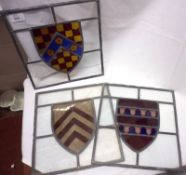 Three Lead Glazed Panels with central coloured heraldic shield-type designs, 12” high (several