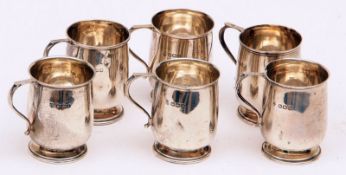 A set of six early 20th Century Miniature Tankards in the Georgian style, raised on round