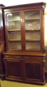 A late 19th Century Mahogany Bookcase Cabinet, with moulded cornice over two glazed doors