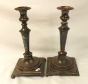 A pair of George III period Sheffield Plated Candlesticks on square bases with integral round