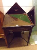 An Edwardian Mahogany Envelope Card Table, folding and swivelling top fitted with green baize,