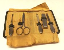 A Cased Birmingham hallmarked Five Piece (of six) Manicure Set, in green fabric-lined case