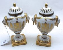 A pair of modern Covered Urns by Chelsea House with pierced lids, decorated with gilt design and