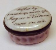 A Bilston Pink Enamelled Oval Patch Box, the white enamelled lid inscribed “Wafted By Friendship’s