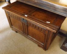 An 18th Century Oak Coffer with later adaptions, the two panelled top with iron fittings, front with