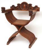 An unusual late 19th Century X-Framed Side Chair, the back extensively carved with mythological