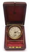 A CWC Vintage Travelling Alarm Clock in brass case, in a folding mahogany case, circa late 19th/